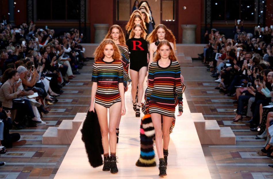 Models on the runway strut out in tribute of Sonia Rykiel. Photo: Reuters