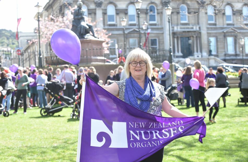 Midwife Maureen Donnelly takes part in the  gathering she organised in the Octagon to support Otago midwives. Photos by Peter McIntosh.