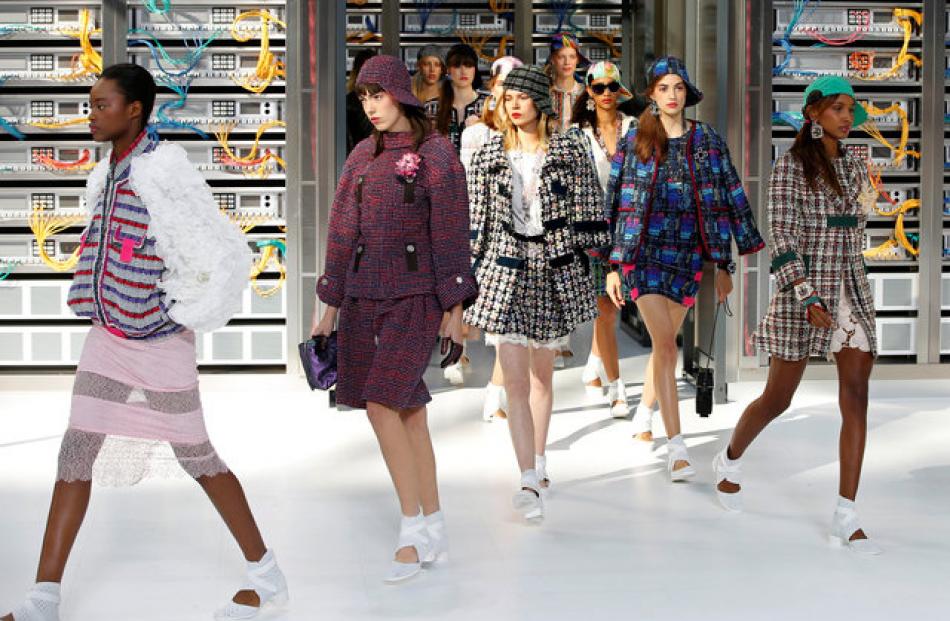 Models present the Spring/Summer collection after walking out of the 'Chanel data centre'. Photo:...