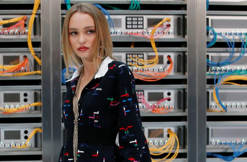 Johnny Depp's daughter actress Lily-Rose Depp poses during a photocall before the Chanel show....