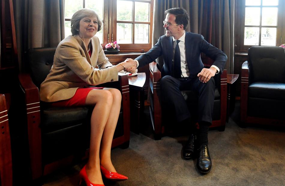 British Prime Minister Theresa May delivers the Brexit message to Netherlands’ Prime Minister Mark Rutte, during a meeting last Monday at the Ministry of General Affairs, in The Hague. Photo from Reuters.