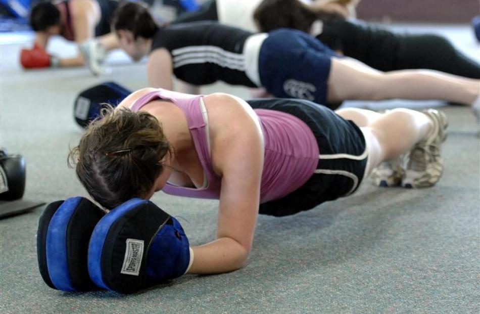 Ellie Constantine participates in a "World title Boxing class" at World Fitness Centre. Photos by...