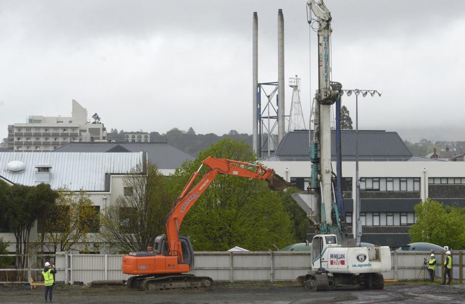 A drill rig gets to work in a project to build student accommodation for Otago Polytechnic. Photo...