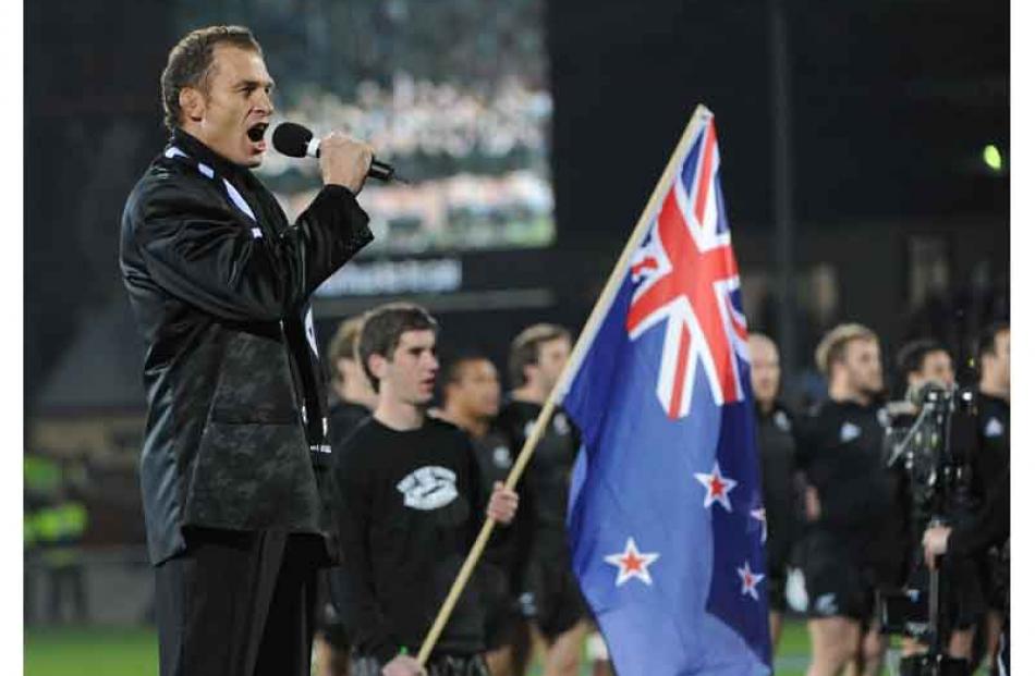 Jud Arthur sings the national anthem. Photo by Peter McIntosh.