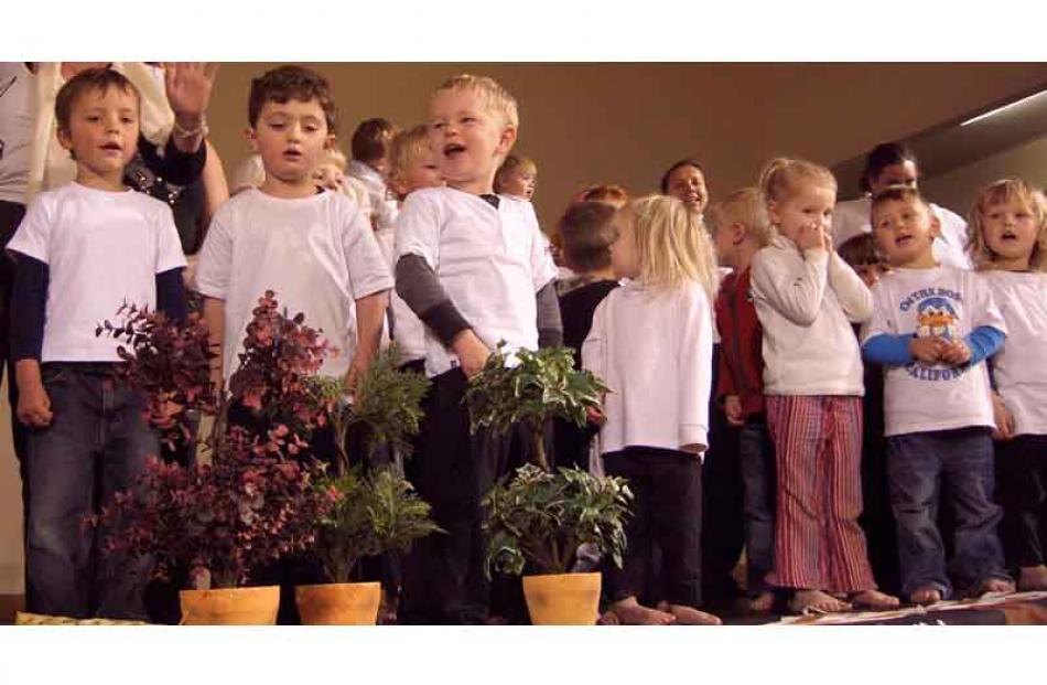 Nickalous Paul (3) of Waikouaiti, (centre) leads children of Big Steps Educare and Waikouaiti...
