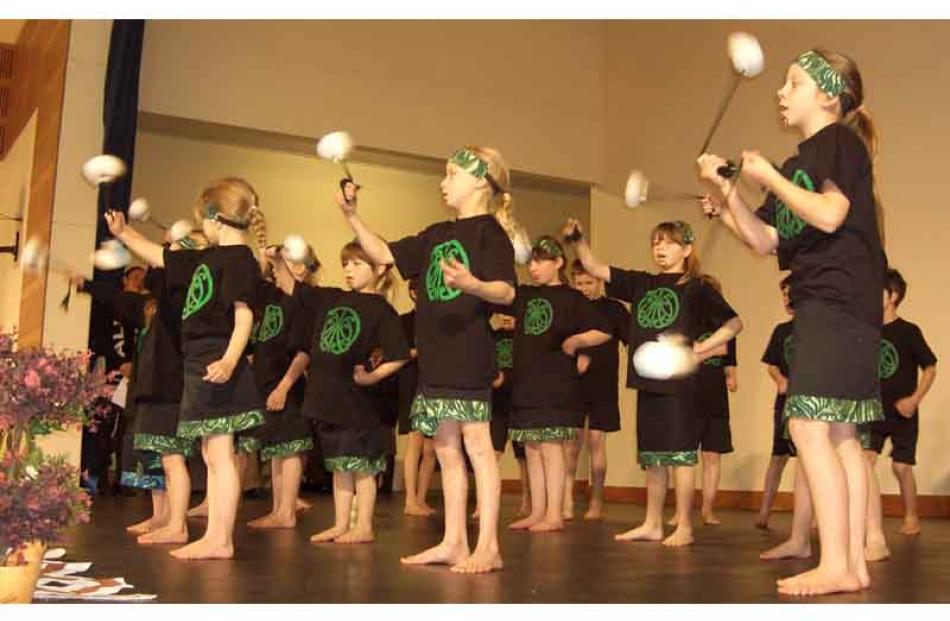 Macraes-Moonlight and Flag Swamp combined schools' group performs the poi waiata 'E rere taku poi'.
