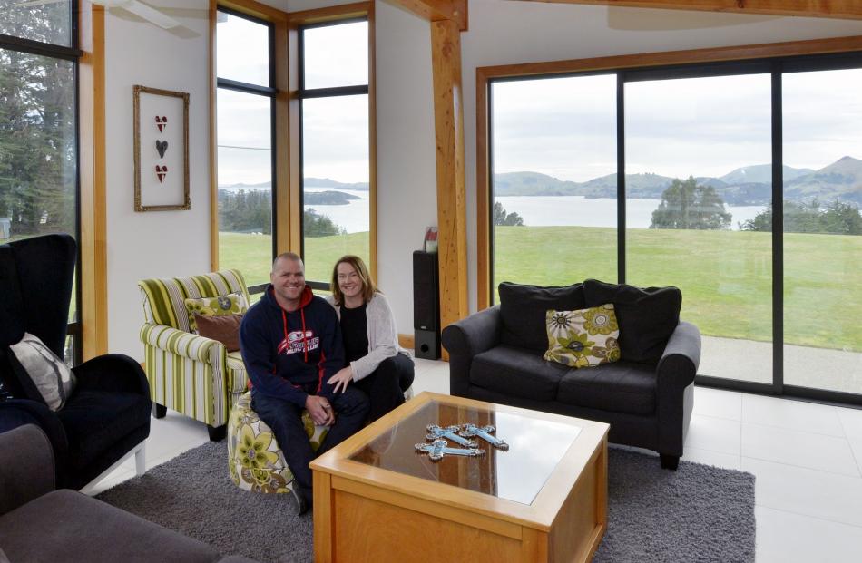 Bevan and Deborah Palmer in the St Leonards home they created for themselves and their three...