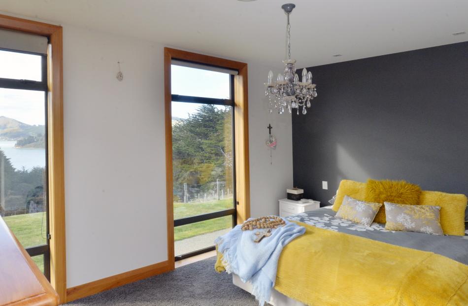 The owners’ bedroom is at the most private, eastern, end of the house and looks down Otago Harbour.