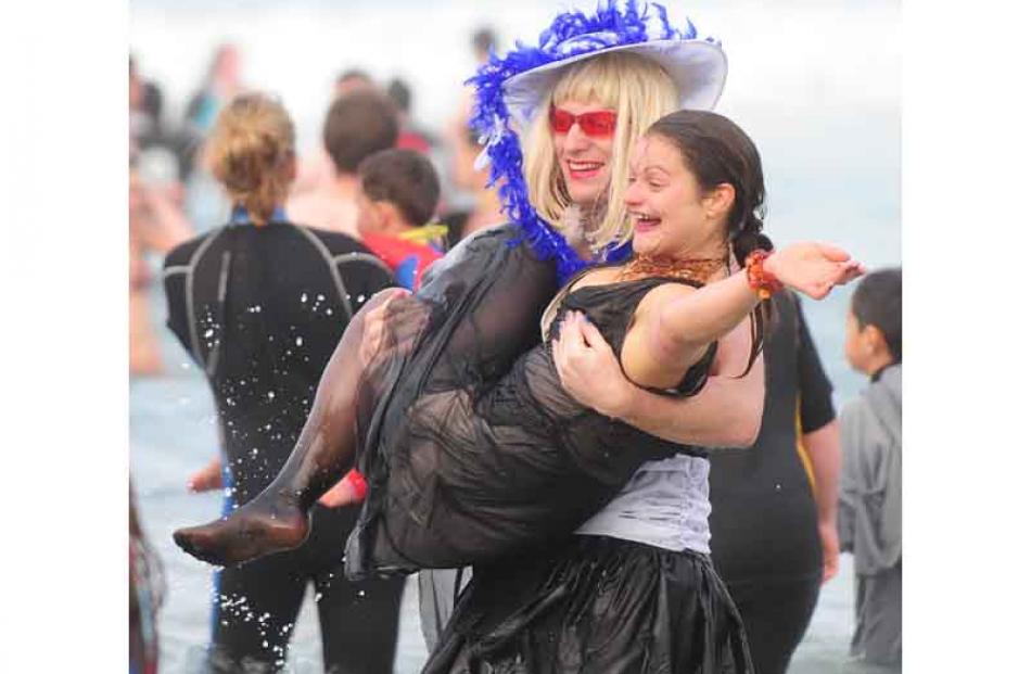 Daniel Bell (left) attempts to save Jodi-Lee Williams from the frigid waters of St Clair beach.