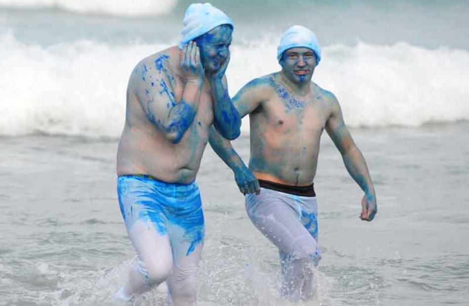 Smurfs up: Cory Buchanan (28) (left) and Jake 
Hawker (22).