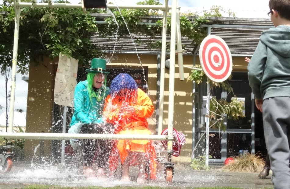 Year 7 teacher Alice Denley (left) and year 3 teacher Yvonne Culling were repeatedly soaked.