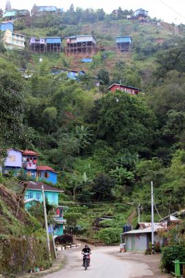 A typical small-town main street scene in mountainous Chin State, Myanmar.