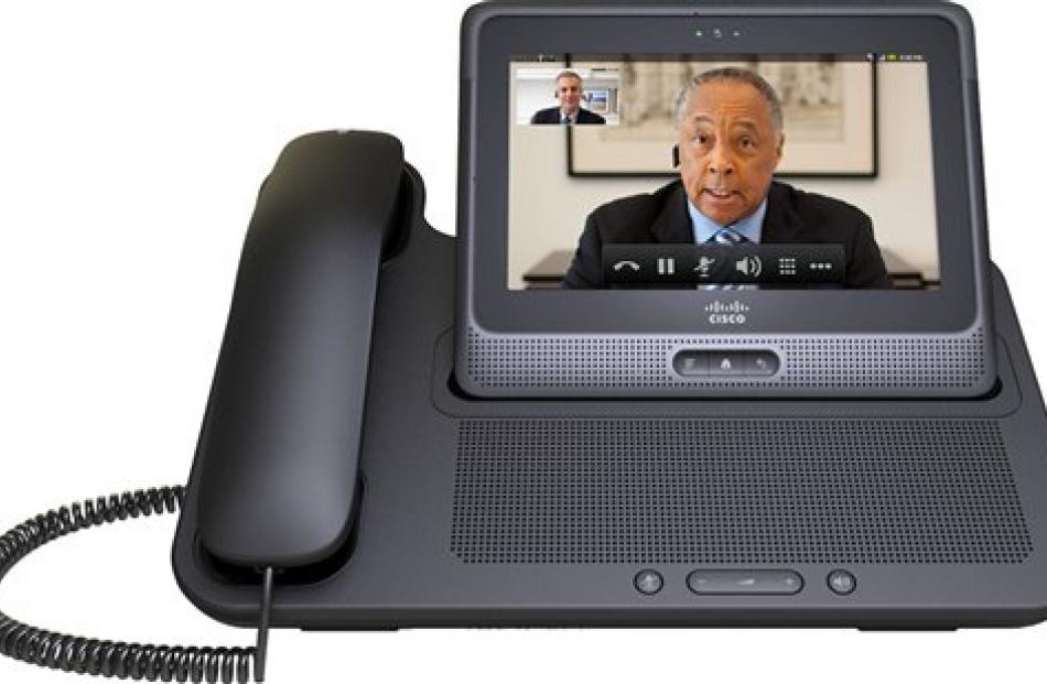 Cisco's Cius stands in its docking station with a handset. Photo by AP.