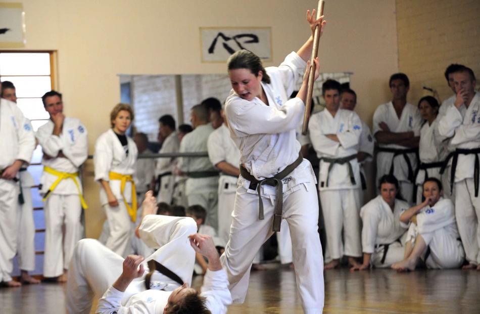 Zoe demonstrates self-defence with partner Karl Rademacher.