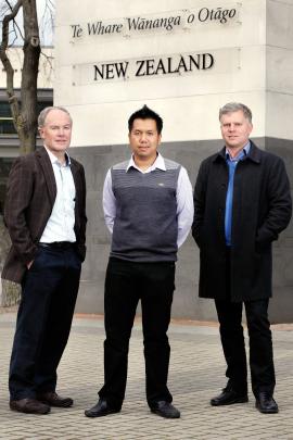 Dr Htin Lin Aung (centre) with microbiology and immunology department professor Greg Cook (left)...