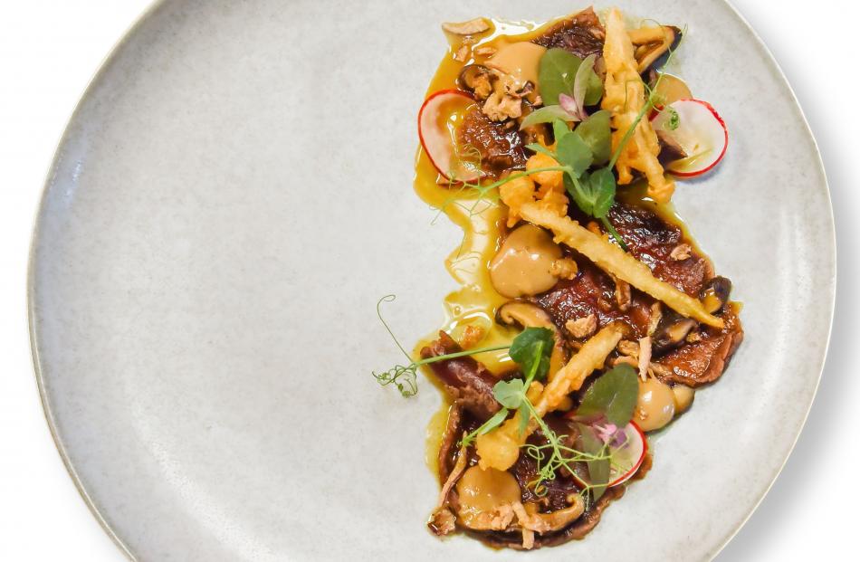 Greg Piner’s dish of cured venison short loin, trio of mushroom, pickled shiitake, sep puree, tempura needle mushrooms, compressed radish, ponzu, black truffle salt, pea tendrils and crispy shallots.