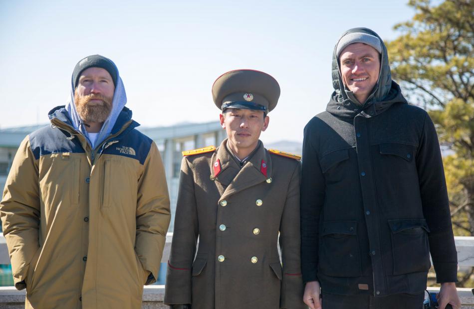Smoothy (left) and Will Lascelles with a North Korean soldier.