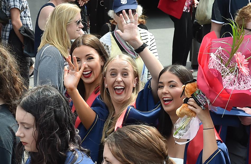 Enjoying themselves during the polytech graduation parade along George St yesterday are (from...