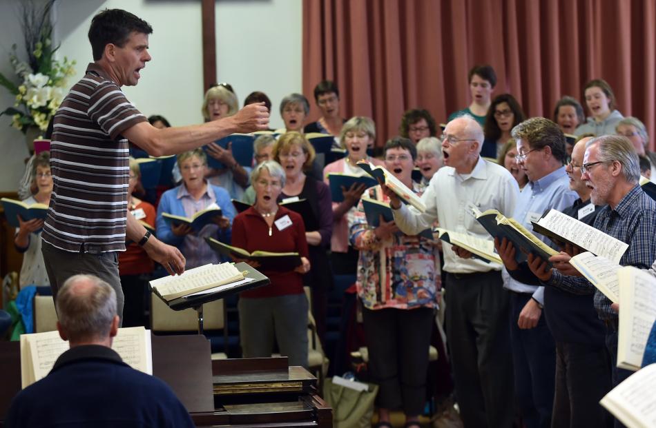 David Burchall, conductor and musical director of City Choir Dunedin’s Christmas Oratorio, takes a full choir rehearsal for the production. Photo by Peter McIntosh.
