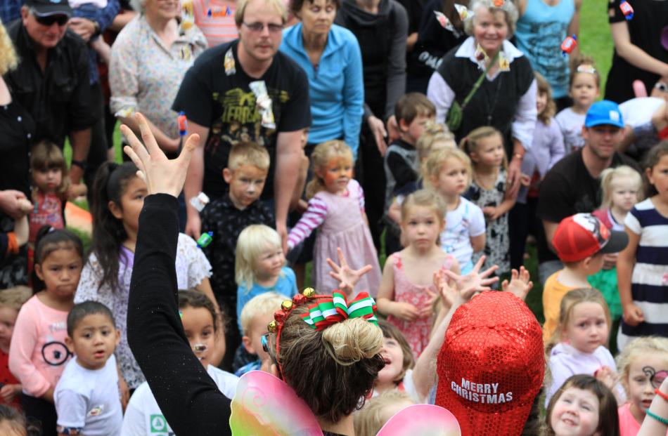 Christmas in the Park helpers Grace Allan (17) and Tanita Lind (18), both of Oamaru, get the 4...
