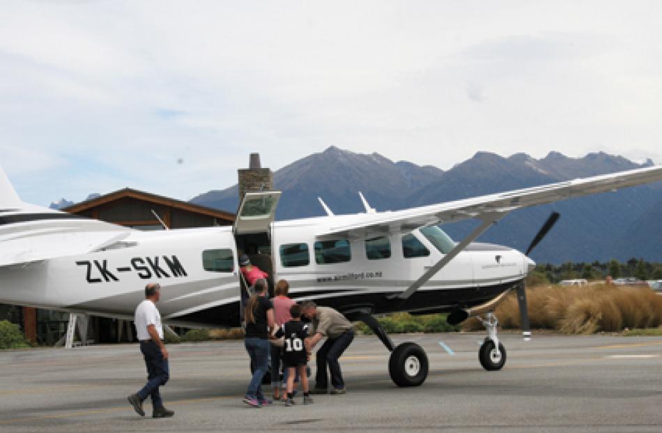Passengers embark the aircraft for their scenic flight. 