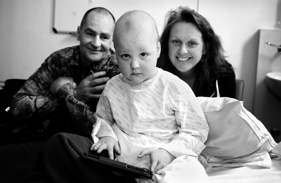 Kashray's parents, Ray Michelle and Donna Brook, put on brave faces during their son's treatment for leukaemia at Dunedin Hospital in August. Photo by Christine O'Connor.