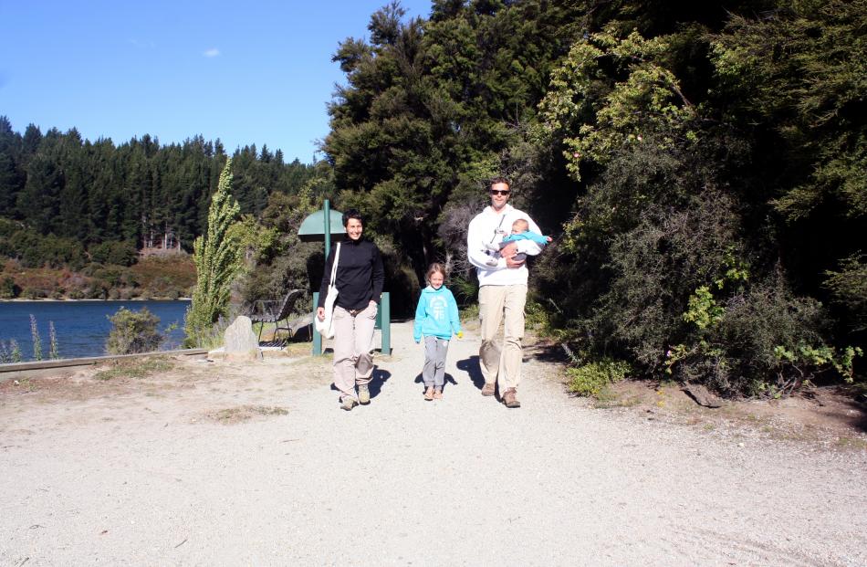 Exiting the Wanaka Outlet Track near the start of the Clutha River are French tourists (from left...