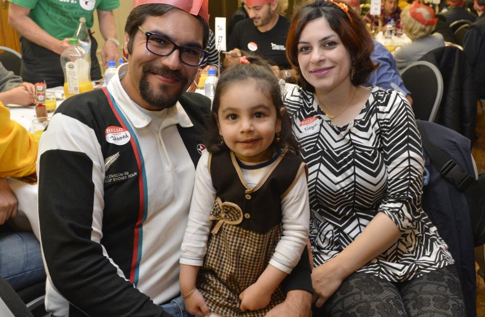 Celebrating Christmas Day with dinner at the Dunedin Town Hall yesterday are (from left) Hamed Peyhani, Mehrsa Peyhani and Negin Khadem. Photos by Gerard O'Brien.