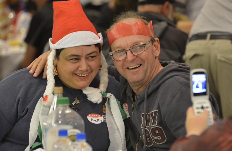 Sharing a little Christmas love are husband and wife Kelly and John Anderson, of Mosgiel.