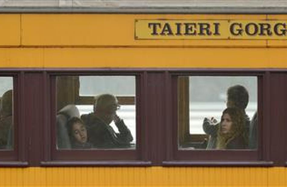 Passengers from the cruise ships Maasdam and Golden Princess travel on a Dunedin Railways train...