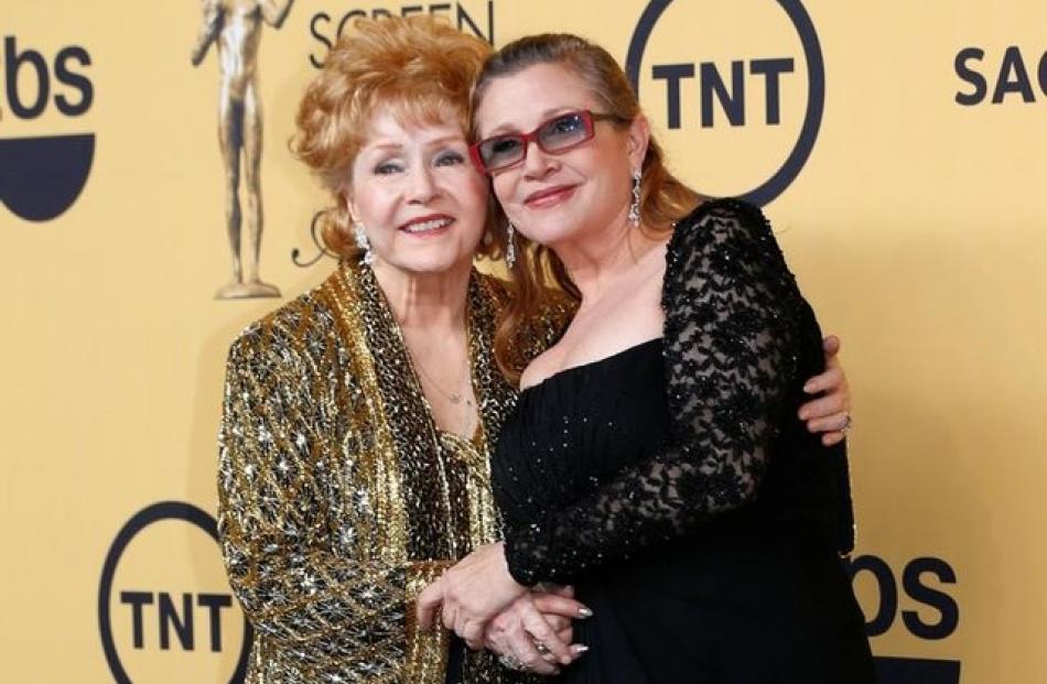Dec 27: Carrie Fisher (60, actress/writer), Dec 28: Debbie Reynolds (84, actress, mother of Carrie Fisher). Photo: Reuters