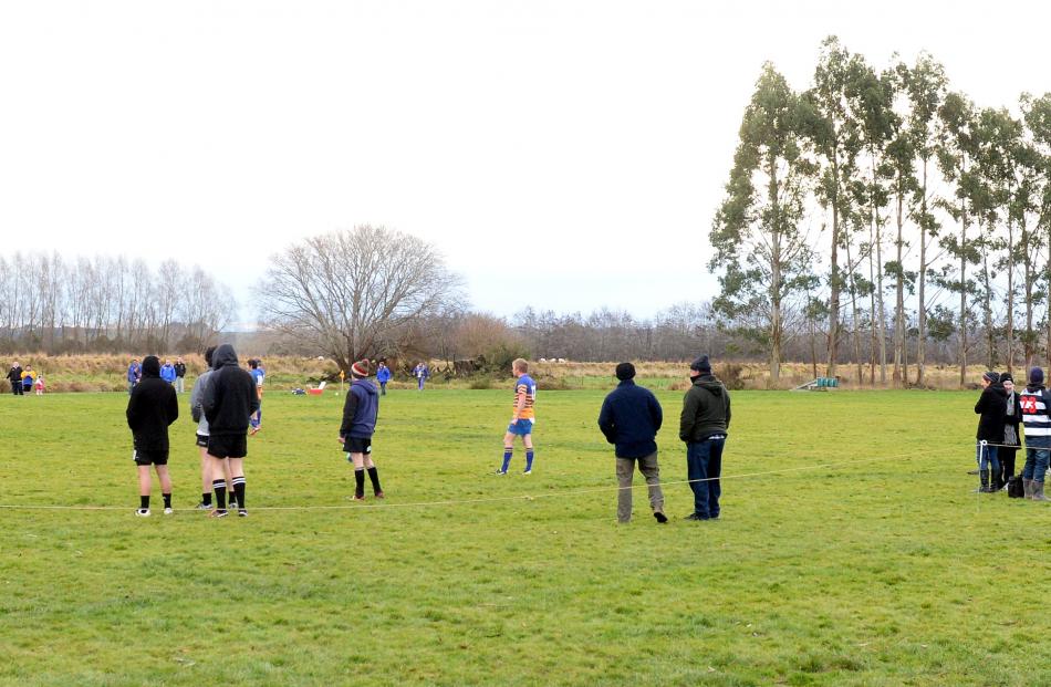 Supporters watch a game between local team Crescents and Taieri in July. Photo: Linda Robertson.