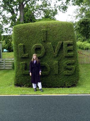 Lois Skellett with the Warrington love hedge. Photo by Chris Skellett.