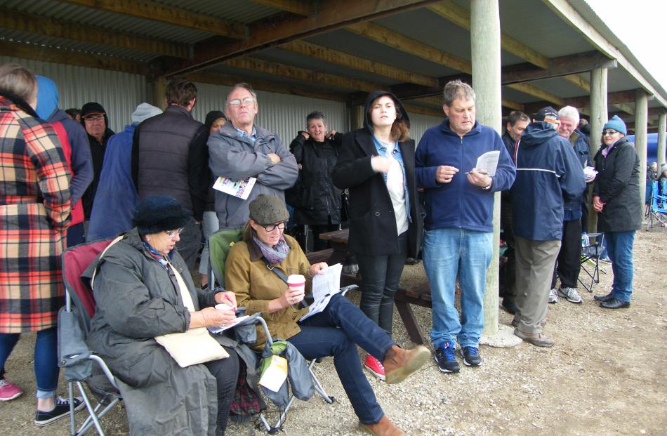 The crowd rugs up at the Roxburgh Trots yesterday. Photos by Pam Jones.