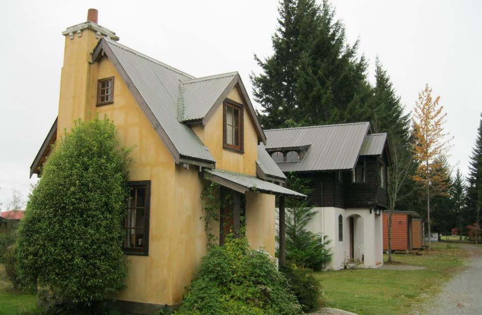 An array of cute cottages built by Erik Nicholson at the Manapouri Holiday Park. 