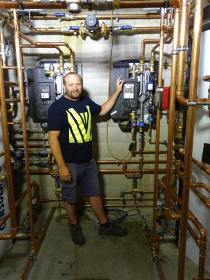Steve Jarvis, of HDS Ltd in Queenstown, with some of the pipe network being used to heat and move...