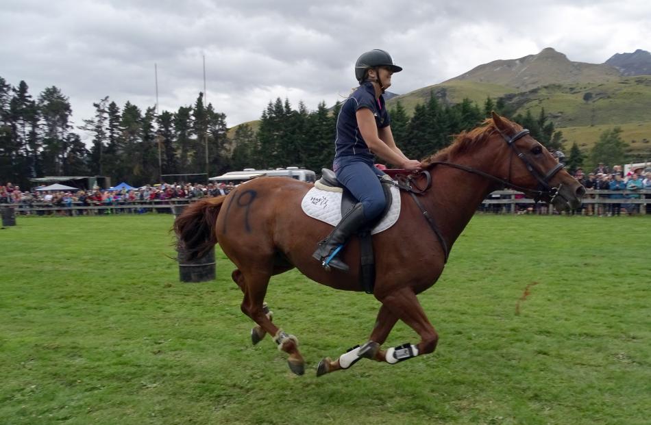 Sunny, ridden by Grace Percy, is in full flight on the way to the finish line in the stockman’s...