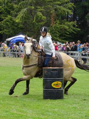 Nicole O’Boyle steers her horse around a barrel during the stockman’s race.