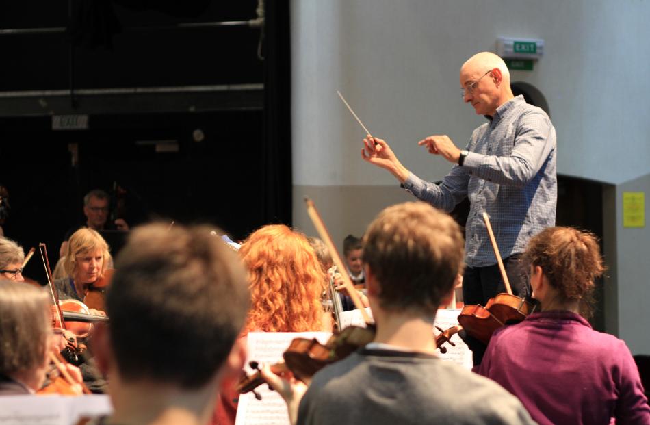  Prof Peter Adams conducts the first full orchestra rehearsal. PHOTOS: HAMISH MACLEAN
