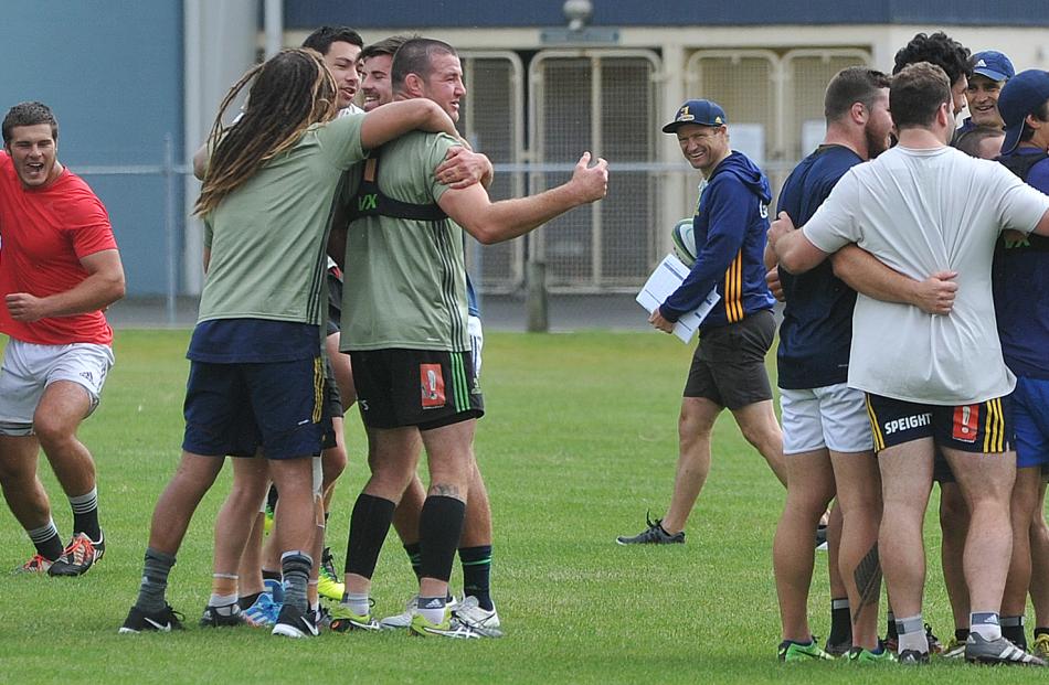 Highlanders players form groups during a game at their first training session of 2017 at the...