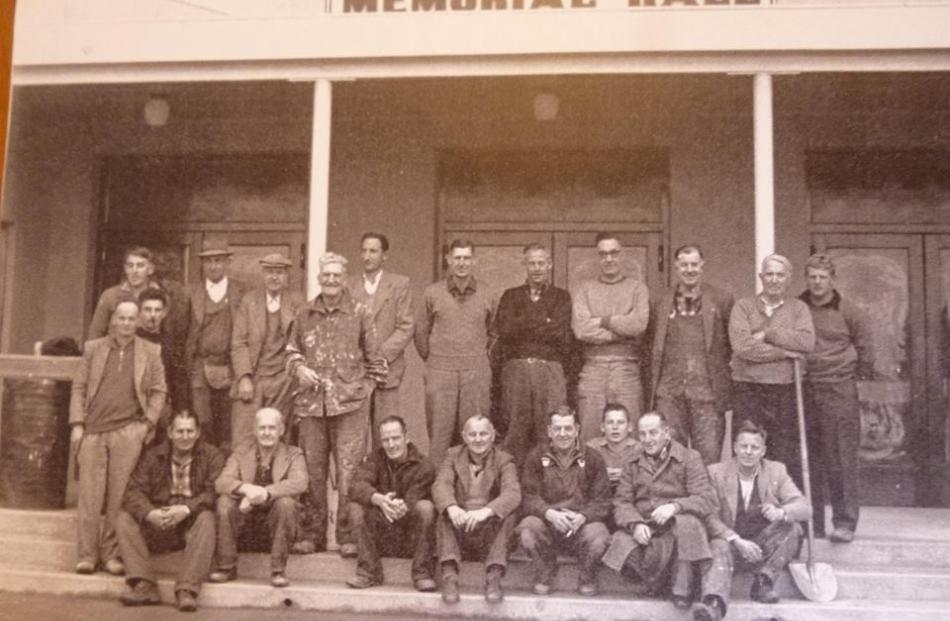 Men who worked on the Cromwell Memorial Hall  outside it, in about 1960. 