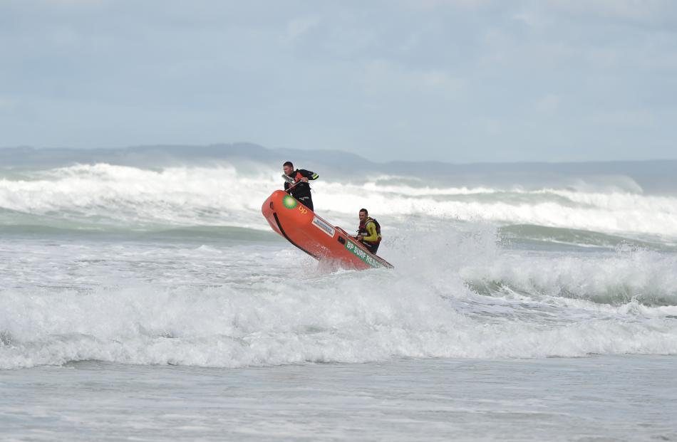 A Brighton Surf Lifesaving Club IRB battles rough seas during the search.