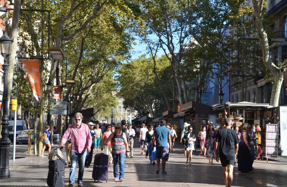 La Rambla Blvd’s shops sell claret-and-blue-striped jerseys, flags and scarfs more than anything...