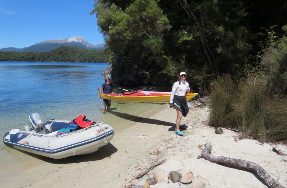 Getting ready for the portage. Mt Titiroa in the distance.