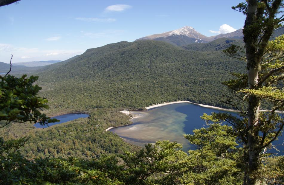 View south from The Monument towards Mt Titiroa, with the beach at the end of Hope Arm. Photos:...