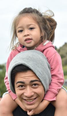 Kiliona Tamati-Tupa'i gives his little brother Waka, both of Auckland, a ride on his shoulders.