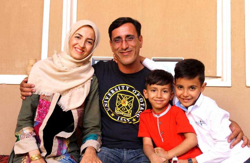 Ms Leili Ghanbari, Dr Ali Falahati, and sons Aryan and Nima at home in Yazd. Photos: Diana Noonan.