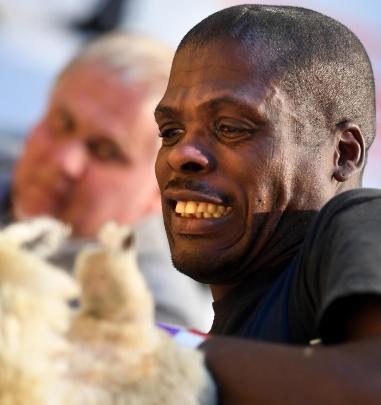 South African blade shearer Bongani Joel is closely observed by a judge as he competes in the All...