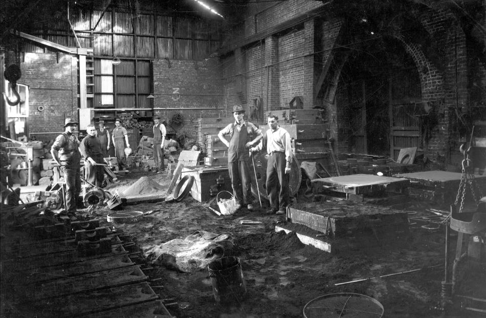 Workers inside the former Stevenson & Cook foundry building in Port Chalmers.