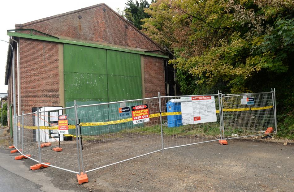 Workers have begun removing the asbestos roof of the former Stevenson & Cook foundry building....